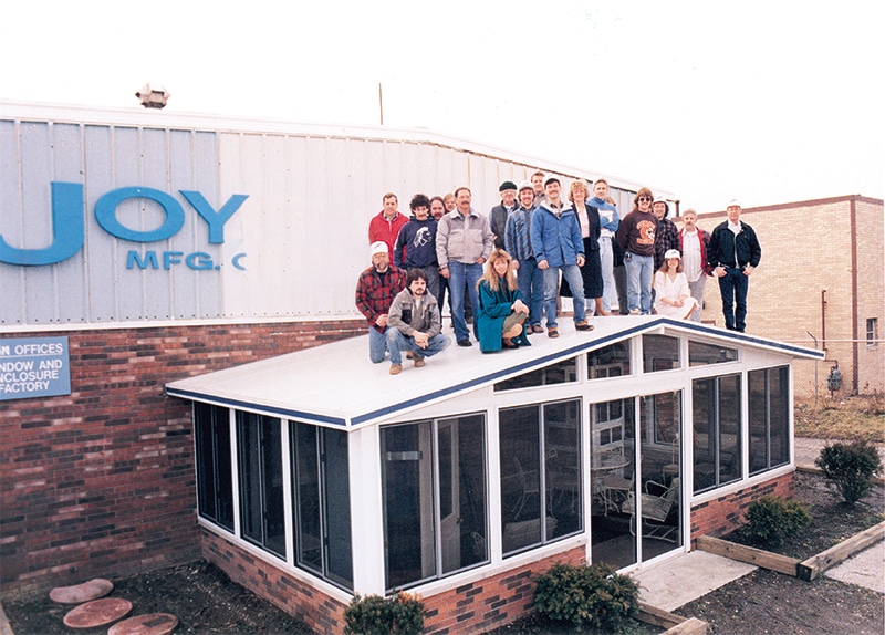 Joyce manufacturing team on top of sunroom roof