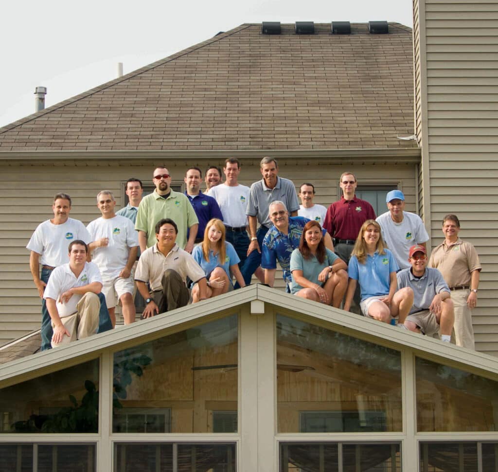 Employees of Joyce Manufacturing on top of sunroom