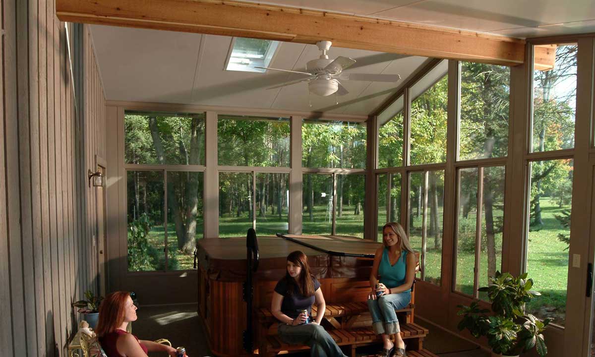 People sitting in newly built sunroom