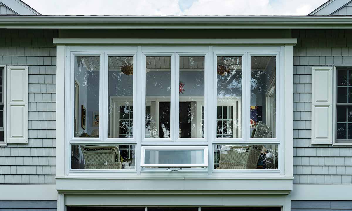 Sunroom from outside peering into living area