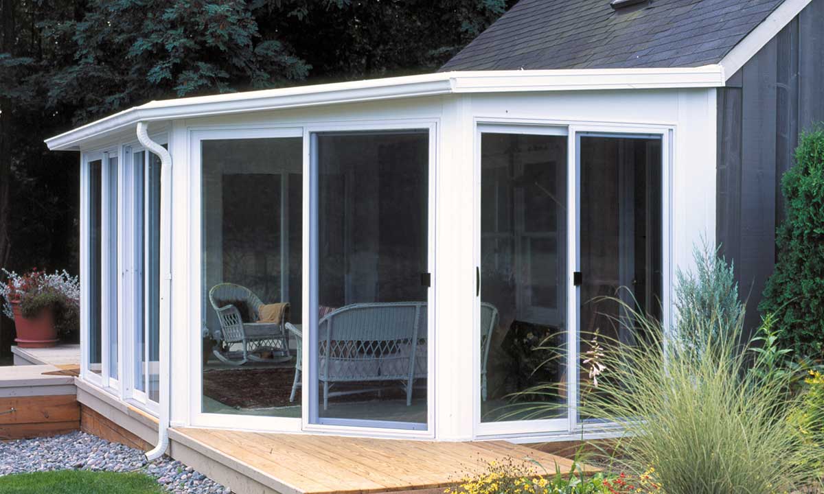 White sunroom with two patio doors