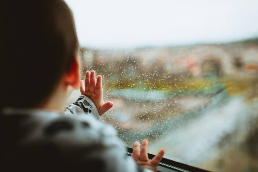 baby looking out window